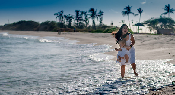 Mother daughter playing in surf I Oahu Photographer