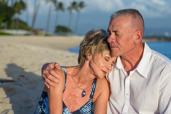 Couple Snuggling on the Beach