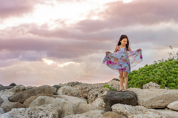 Girl dancing on rocks at sunset I Oahu Photographer